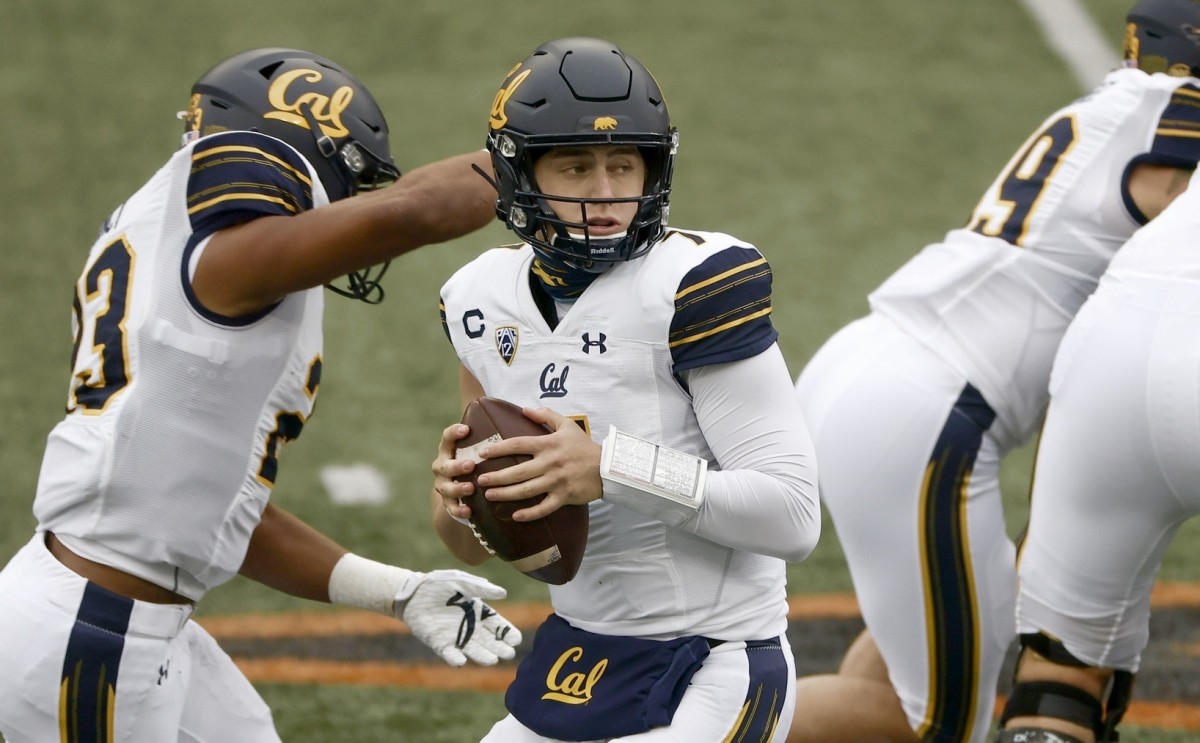 Cal quarterback Chase Garbers drops back to pass against Oregon State