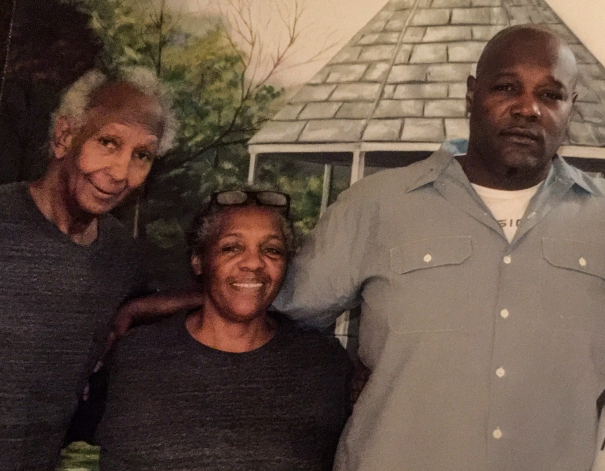 Clifford (far right) with his mother, Emily, and stepfather, Enoch Wright Jr., at Elayn Hunt.