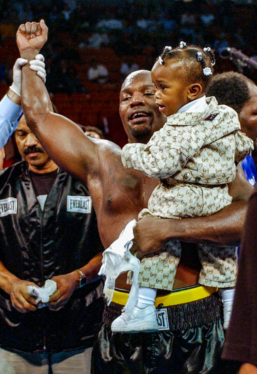 The Black Rhino and his daughter, Jacol'e, in February 2002, after a seventh-round TKO of Gabe Brown.