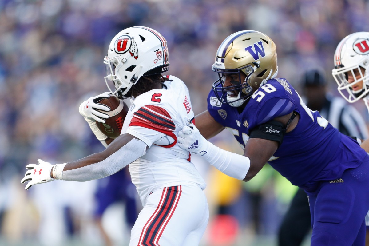 Zion Tupuola-Fetui pulls down Utah's Zack Moss in the 2019 game, won by the Utes 33-28.