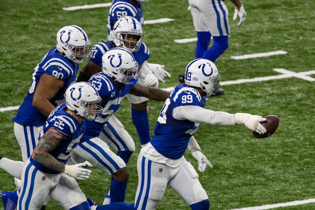 Indianapolis Colts defensive tackle DeForest Buckner shows the football after recovering a fumble in overtime of a Week 11 home win over the Green Bay Packers. The turnover set up the game-winning field goal.