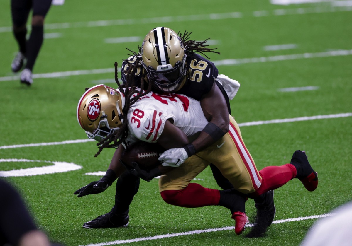 Nov 15, 2020; New Orleans, Louisiana, USA; New Orleans Saints linebacker Demario Davis (56) hits San Francisco 49ers running back JaMycal Hasty (38) during the second half at the Mercedes-Benz Superdome. Mandatory Credit: Derick E. Hingle-USA TODAY 
