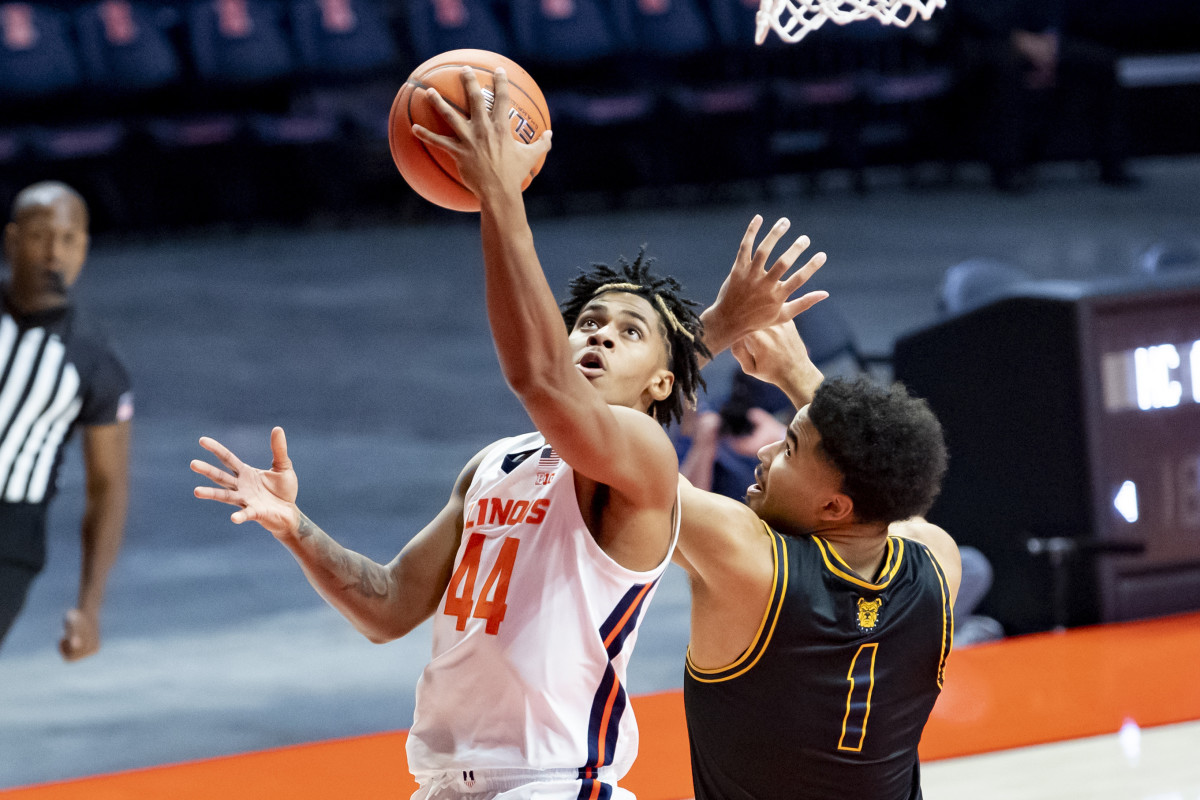 Illinois Fighting Illini guard Adam Miller (44) goes up for a shot against North Carolina A&T Aggies forward Jeremy Robinson (1) during the first half at the State Farm Center. Miller finished with 28 points in the 122-60 win. 