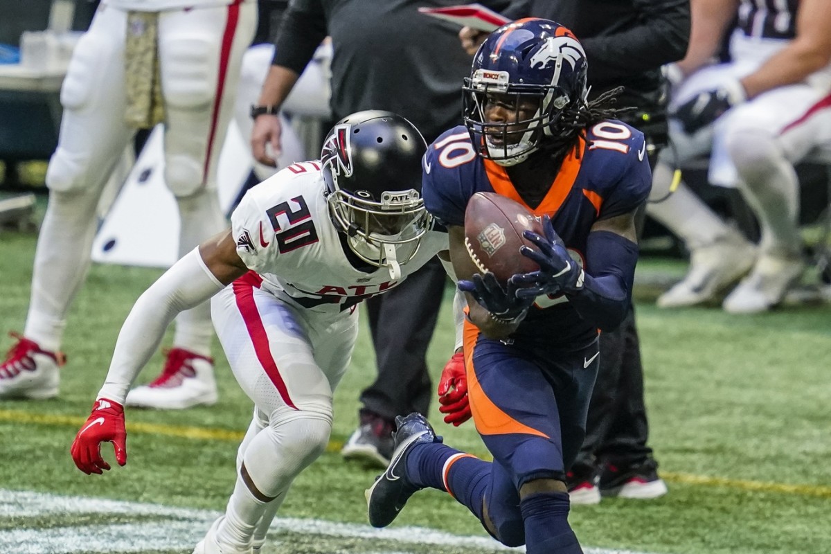 Nov 8, 2020; Atlanta, Georgia, USA; Denver Broncos wide receiver Jerry Jeudy (10) catches a long pass behind Atlanta Falcons cornerback Kendall Sheffield (20) during the second half at Mercedes-Benz Stadium. Mandatory Credit: Dale Zanine-USA TODAY 