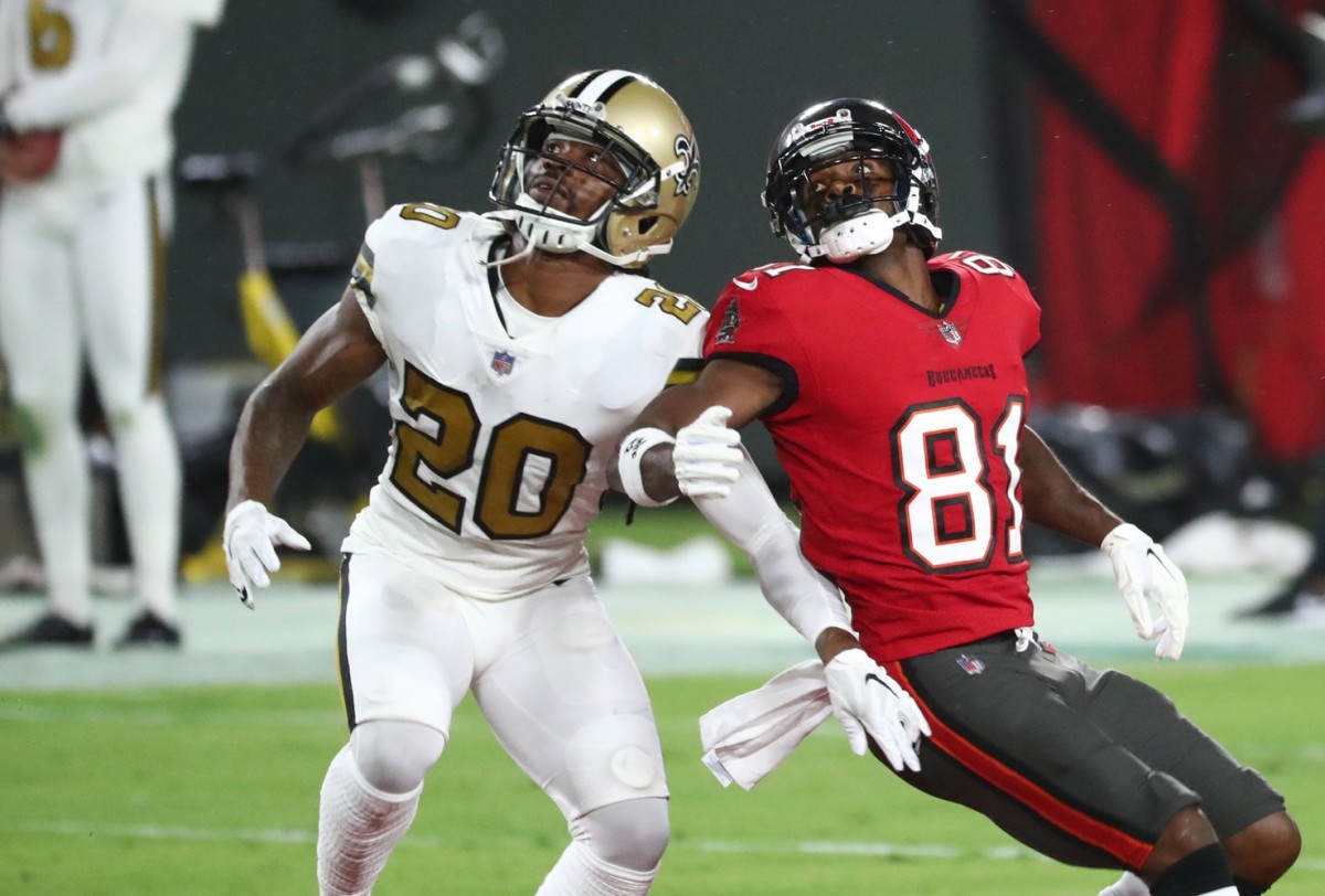 Nov 8, 2020; Tampa, Florida, USA; Tampa Bay Buccaneers receiver Antonio Brown (81) and New Orleans Saints cornerback Janoris Jenkins (20) look up for a pass in the first quarter of a NFL game at Raymond James Stadium. Mandatory Credit: Kim Klement-USA TODAY 