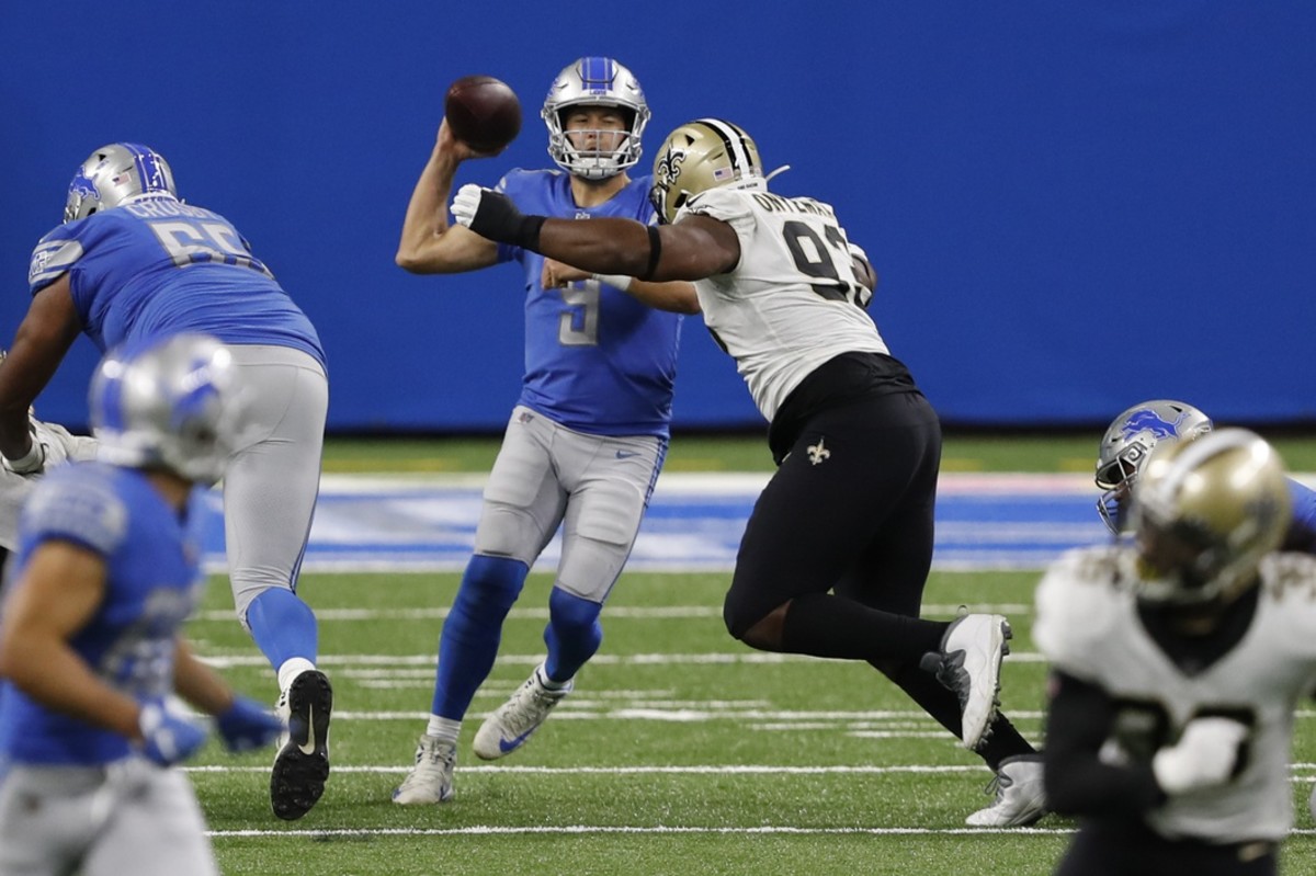 Oct 4, 2020; Detroit, Michigan, USA; Detroit Lions quarterback Matthew Stafford (9) gets pressured by New Orleans Saints defensive tackle David Onyemata (93) during the fourth quarter at Ford Field. Mandatory Credit: Raj Mehta-USA TODAY 