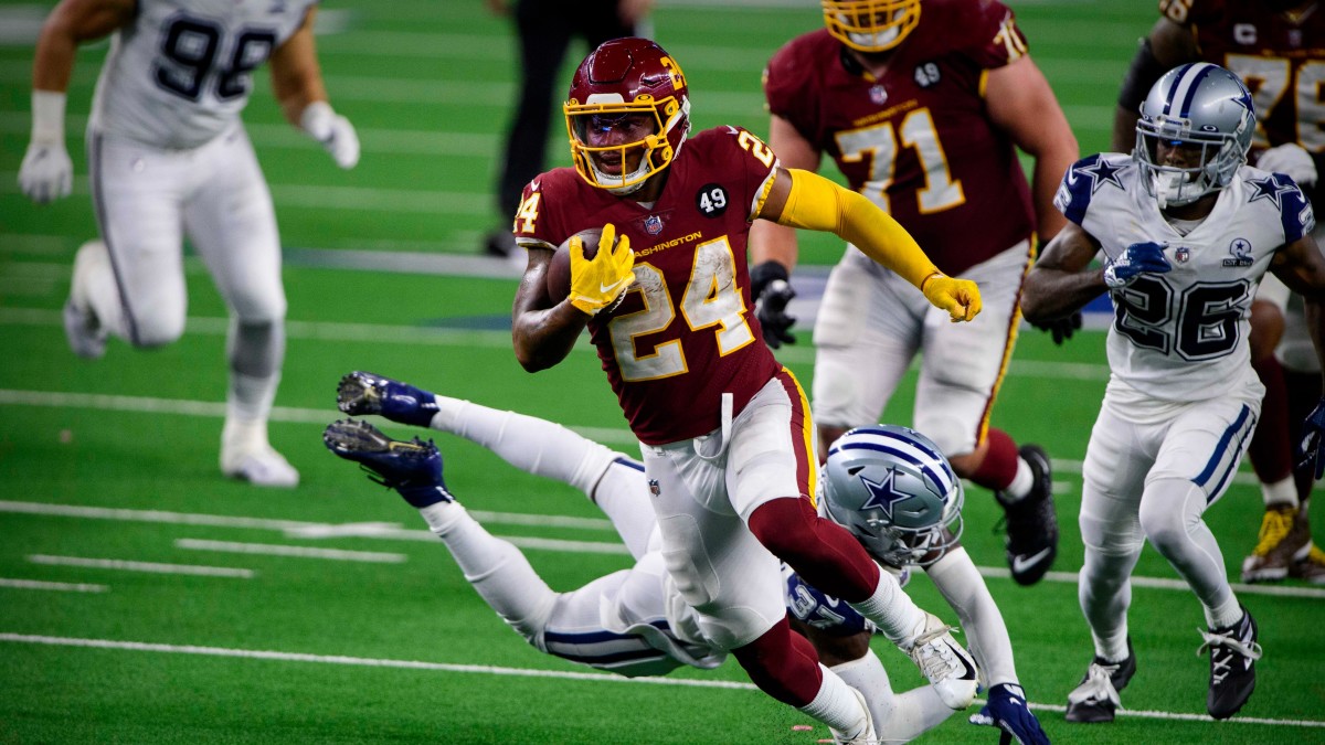 Washington Football Team running back Antonio Gibson (24) runs for a touchdown against the Dallas Cowboys during the second half at AT&T Stadium.