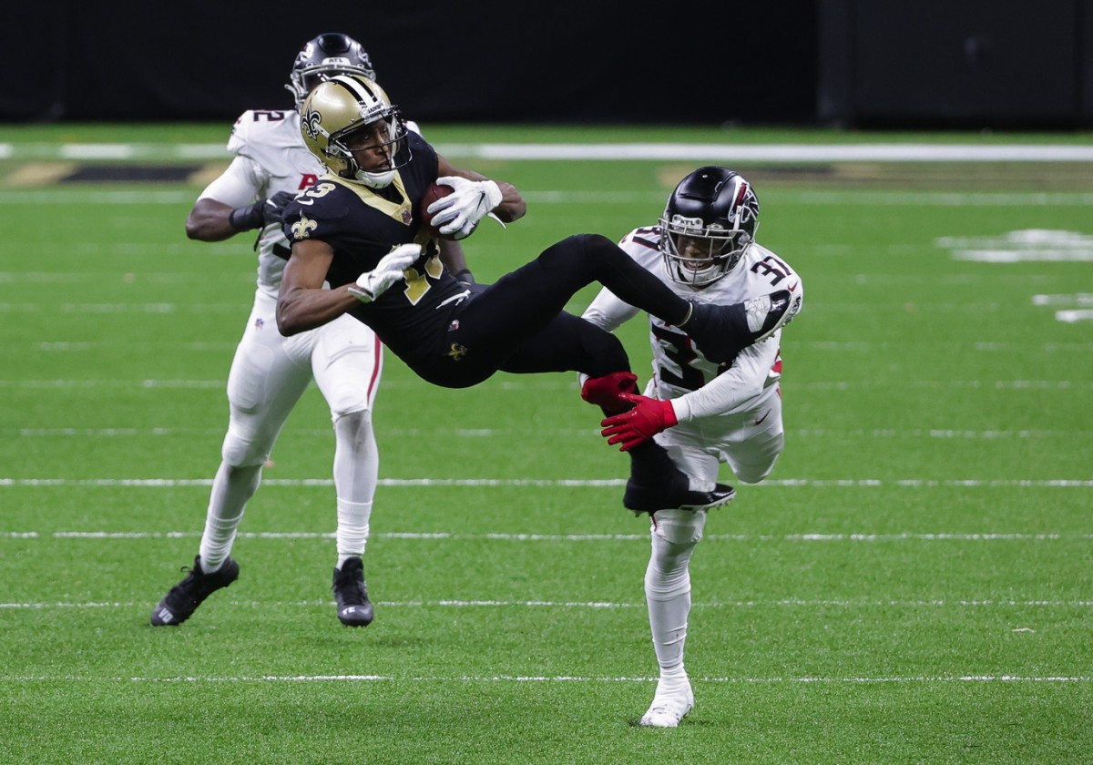 Nov 22, 2020; New Orleans, Louisiana, USA; New Orleans Saints wide receiver Michael Thomas (13) catches a pass over Atlanta Falcons free safety Ricardo Allen (37) during the second half at the Mercedes-Benz Superdome. Mand