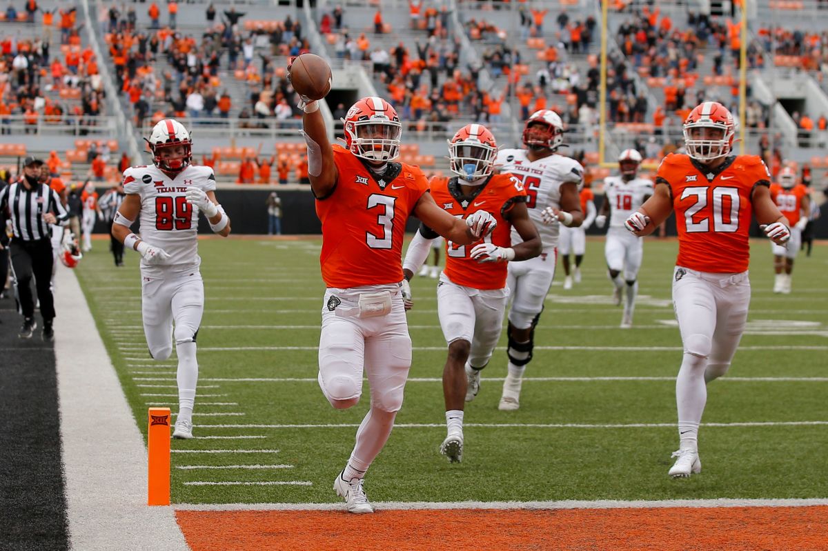 Oklahoma State safety Tre Sterling and his escort hit the end zone on a 65-yard pick six interception.