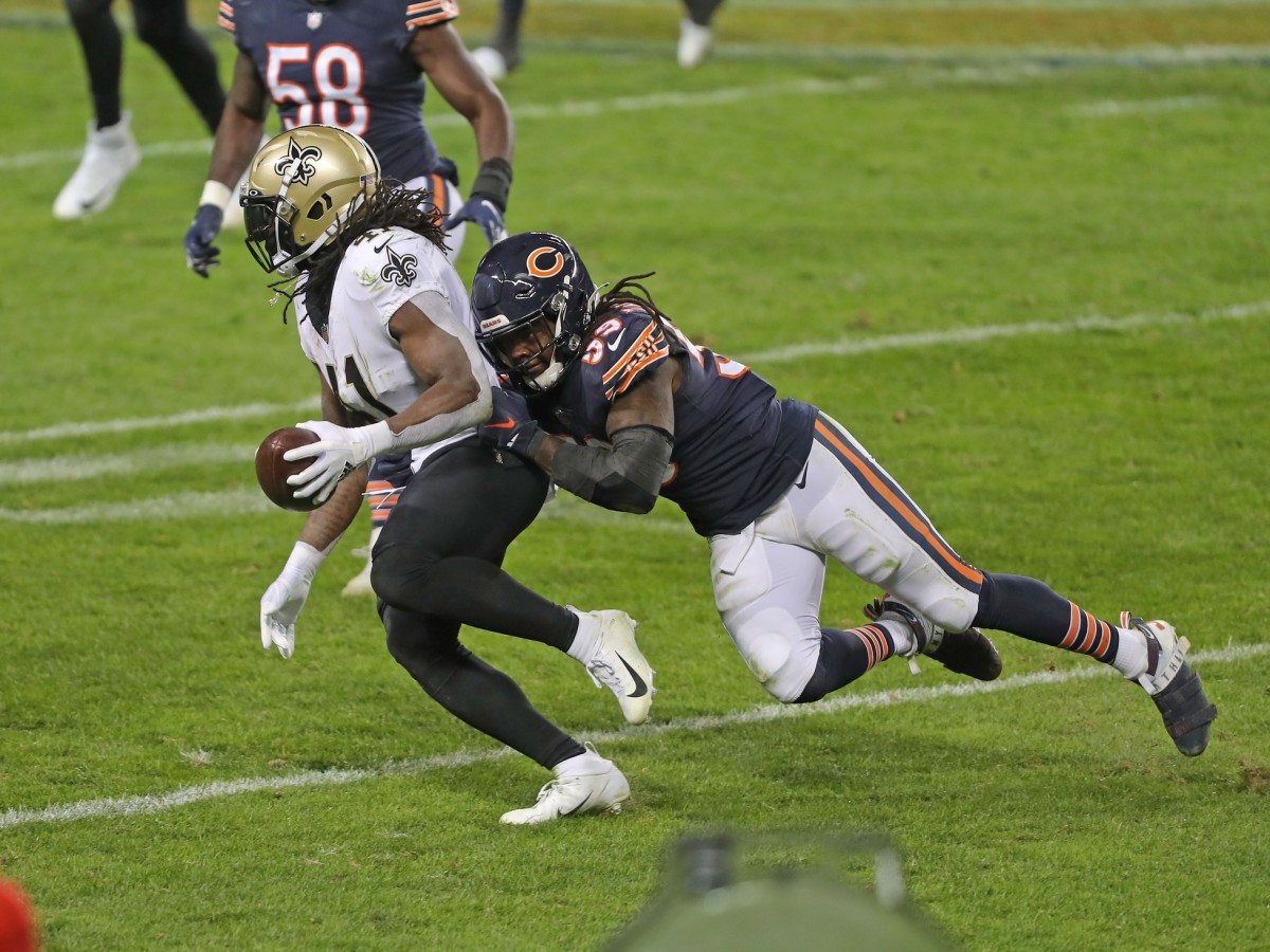 Nov 1, 2020; Chicago, Illinois, USA; New Orleans Saints running back Alvin Kamara (41) is tackled by Chicago Bears inside linebacker Danny Trevathan (59) during the second half at Soldier Field. Mandatory Credit: Dennis Wierzbicki-USA TODAY 