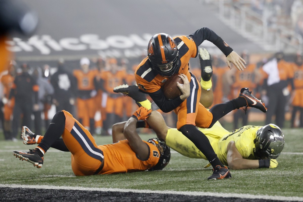 Nov 27, 2020; Corvallis, Oregon, USA; Oregon State Beavers quarterback Tristan Gebbia (3) runs into the end zone for a touchdown against the Oregon Ducks during the second half at Reser Stadium.