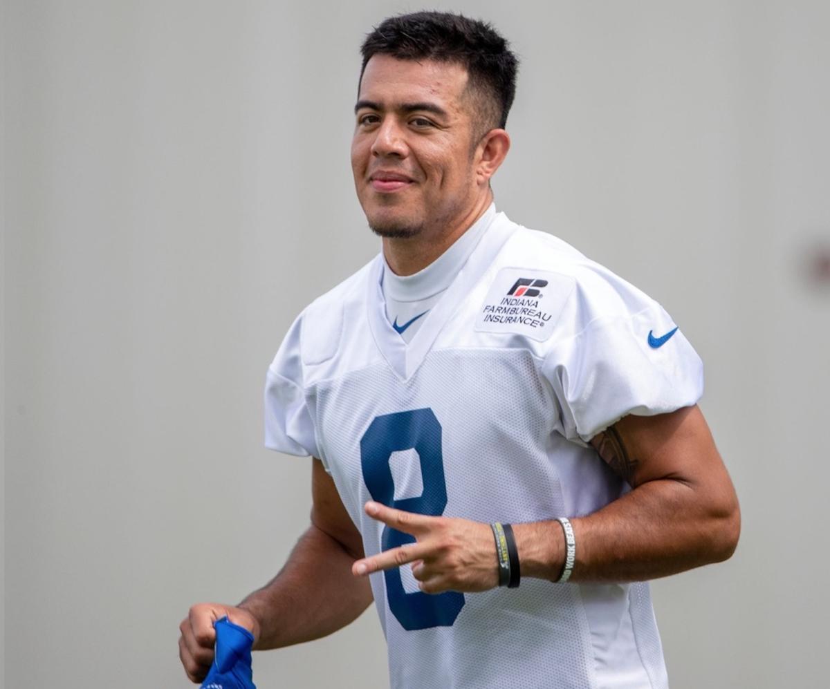 Indianapolis Colts punter Rigoberto Sanchez, who needs Tuesday surgery to remove a cancerous growth, flashes a peace sign during a training camp practice. He's expected to make a full recovery.