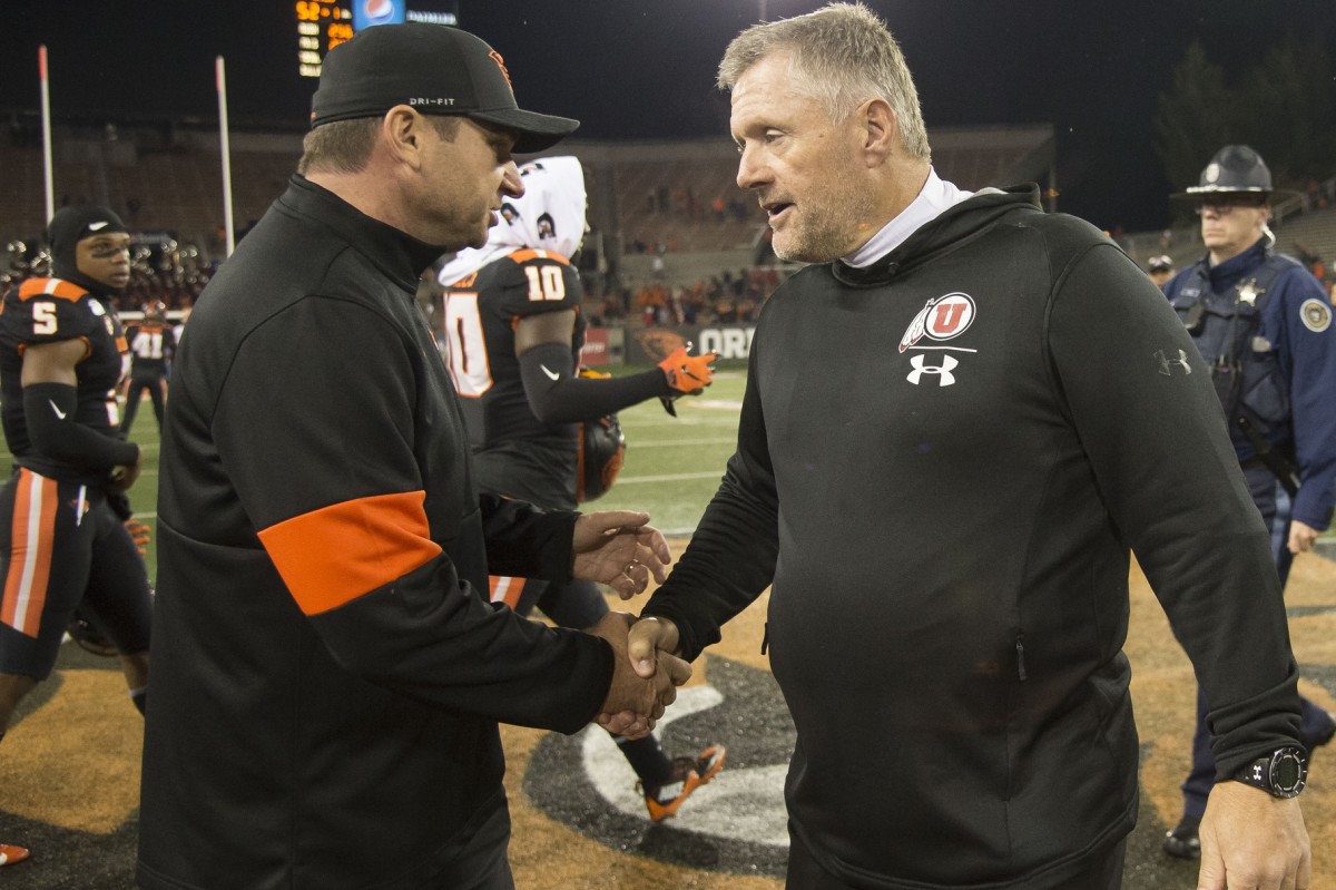 Oct 12, 2019; Corvallis, OR, USA; Oregon State Beavers head coach Jonathan Smith congratulates Utah Utes head coach Kyle Whittingham after a game at Reser Stadium. The Utes beat the Beavers 52-7.