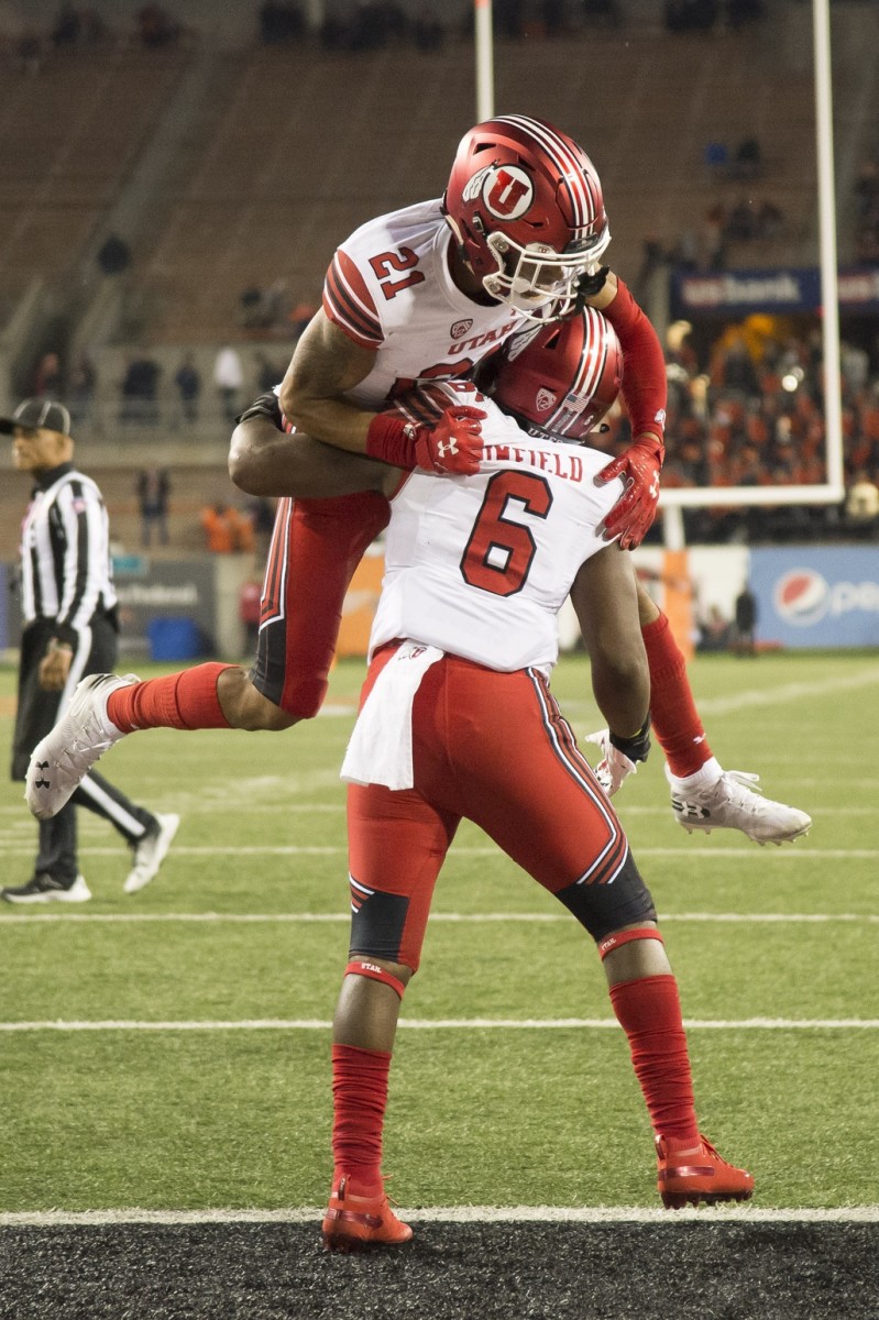 Oct 12, 2019; Corvallis, OR, USA; Utah Utes running back Devin Brumfield (6) celebrates with wide receiver Solomon Enis (21) after scoring a touchdown during the second half at Reser Stadium. The Utes beat the Beavers 52-7.