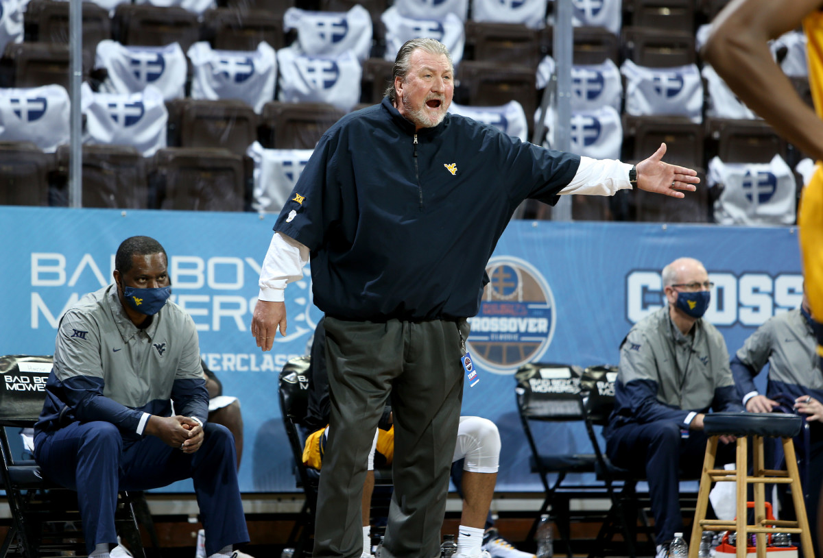 SIOUX FALLS, SD - NOVEMBER 25: Head coach Bob Huggins of the West Virginia Mountaineers shouts to his team during the Bad Boy Mowers Crossover Classic at the Sanford Pentagon in Sioux Falls, SD.