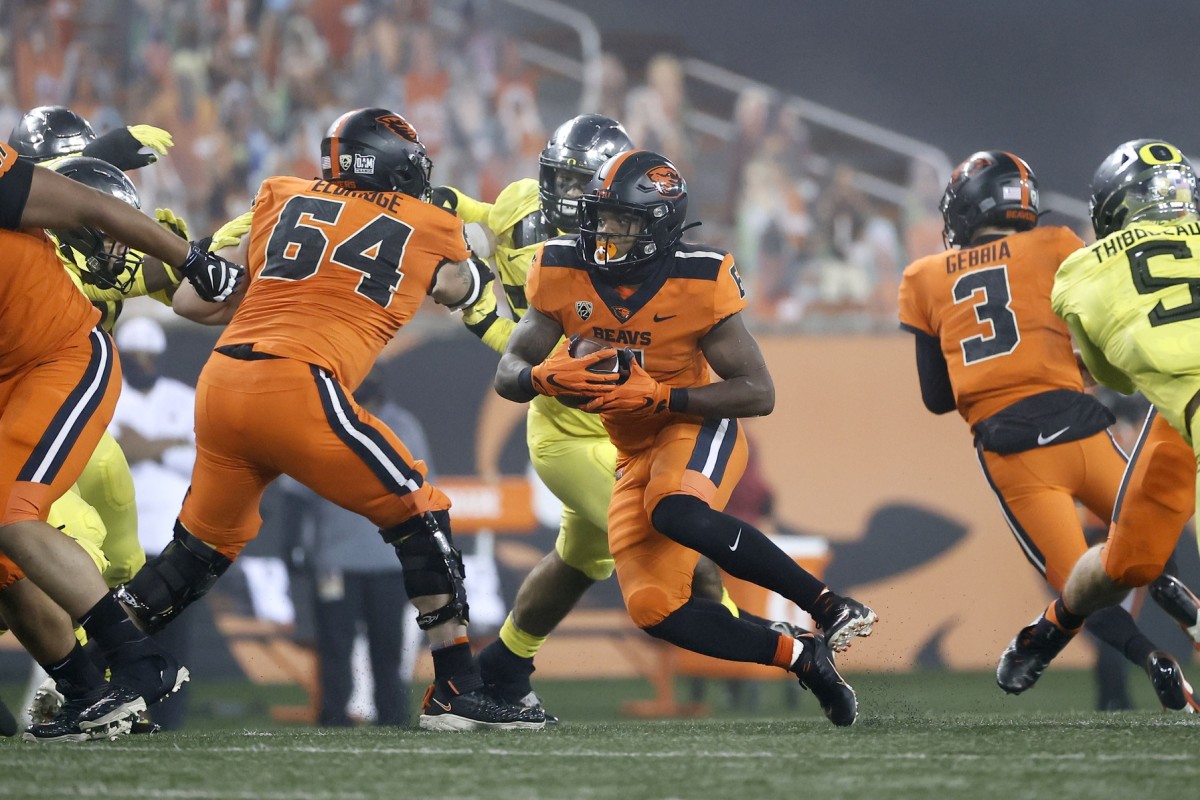 Nov 27, 2020; Corvallis, Oregon, USA; Oregon State Beavers running back Jermar Jefferson (6) carries the ball against the Oregon Ducks during the second half at Reser Stadium.