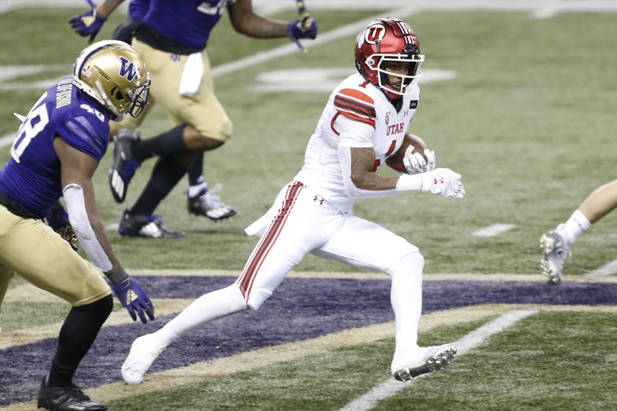 Nov 28, 2020; Seattle, Washington, USA; Utah Utes wide receiver Bryan Thompson (1) runs for yards after a catch against the Washington Huskies during the second quarter at Alaska Airlines Field at Husky Stadium.