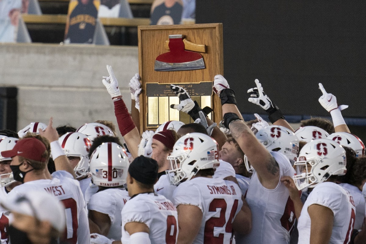November 27, 2020; Berkeley, California, USA; Stanford Cardinal players celebrate with The Stanford Axe after the game against the California Golden Bears at California Memorial Stadium.