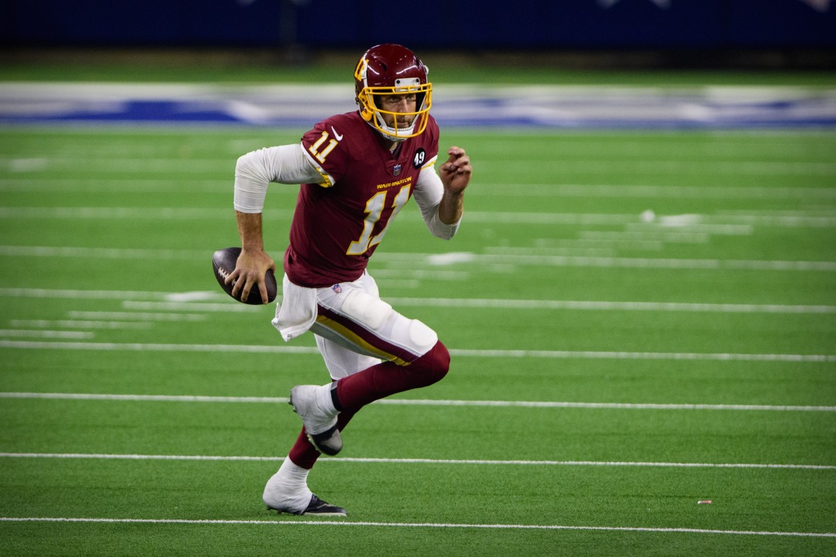 Nov 26, 2020; Arlington, Texas, USA; Washington Football Team quarterback Alex Smith (11) in action during the game between the Dallas Cowboys and the Washington Football Team at AT&T Stadium.