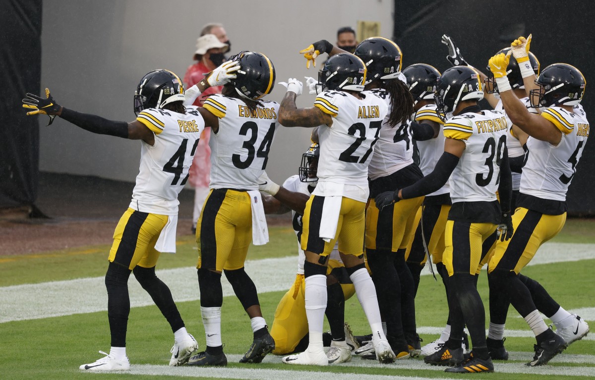 Nov 22, 2020; Jacksonville, Florida, USA; Pittsburgh Steelers players pose after an interception during the second half against the Jacksonville Jaguars at TIAA Bank Field. Mandatory Credit Reinhold Matay-USA TODAY Sports