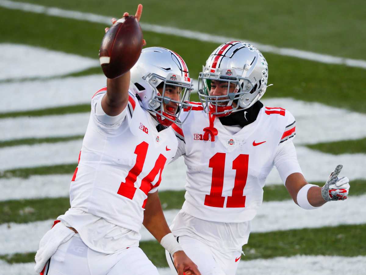 Ohio State Buckeyes quarterback C.J. Stroud (14) celebrates after scoring a rushing touchdown with Ohio State Buckeyes wide receiver Jaxon Smith-Njigba (11)