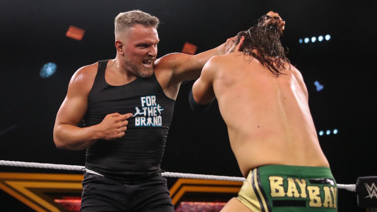 Former NFL punter Pat McAfee participates in a WWE match.