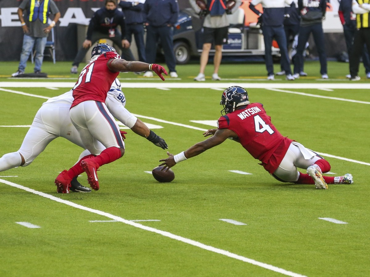 Houston Texans quarterback Deshaun Watson tries to fall on a loose ball after a bad snap near the end of Sunday's 26-20 home loss to the Indianapolis Colts at NRG Stadium.
