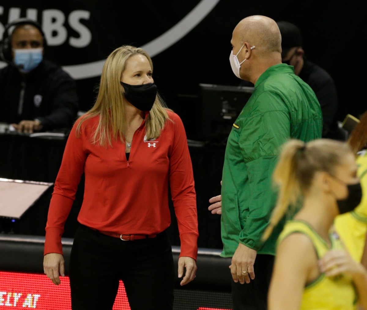 Utah head coach Lynne Roberts speaks with Oregon head coach Kelly Graves prior to the start of the Oregon-Utah game on Sunday, Dec. 6 — © Chris Pietsch/The Register-Guard via Imagn Content Services, LLC