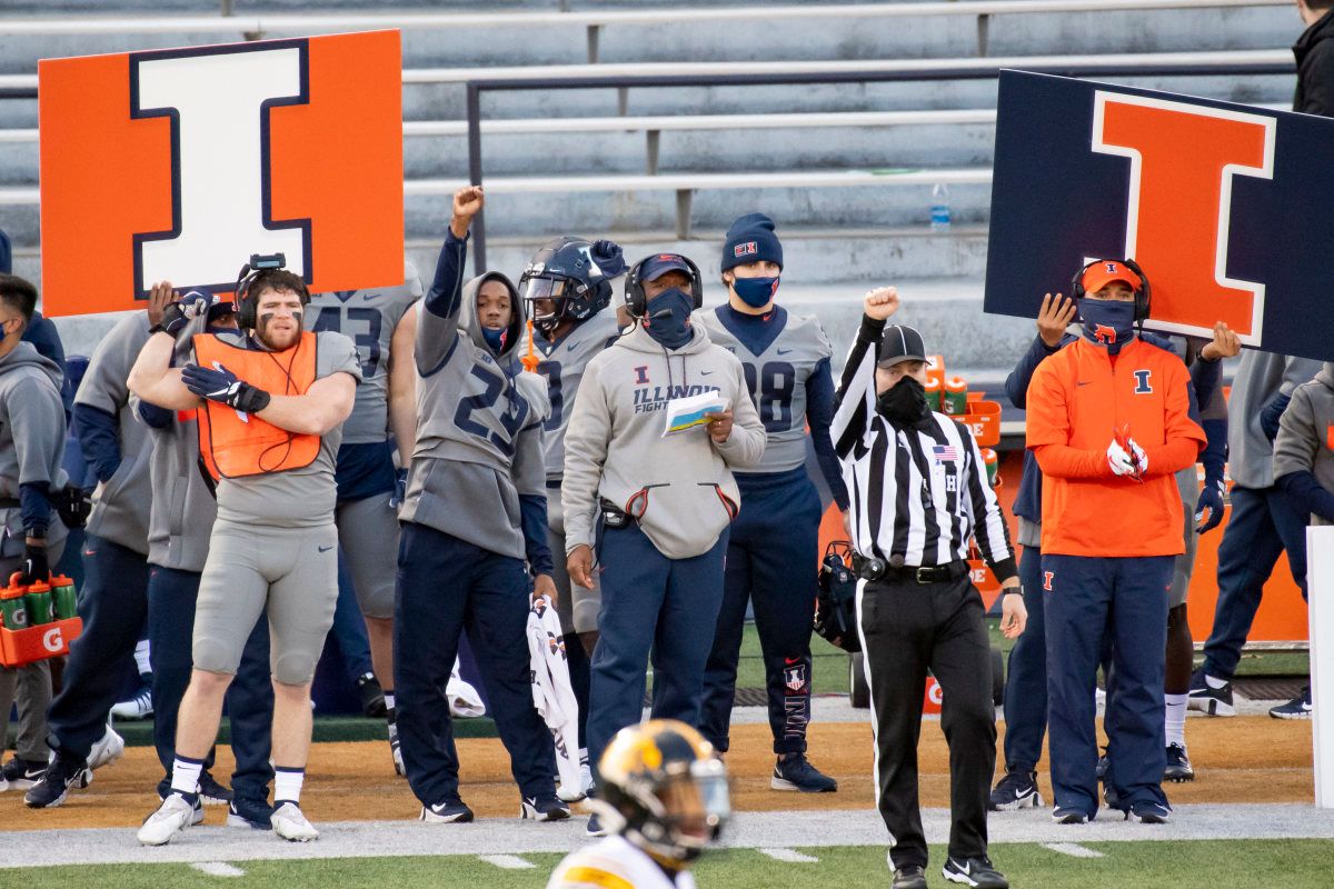 Illinois Fighting Illini head coach Lovie Smith (center) is seen during the first half against the Iowa Hawkeyes at Memorial Stadium.