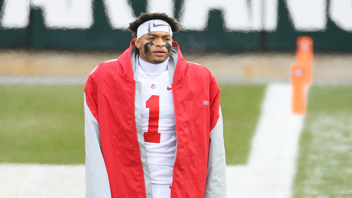 Ohio State QB Justin Fields watches from the sidelines during a game vs. Michigan State