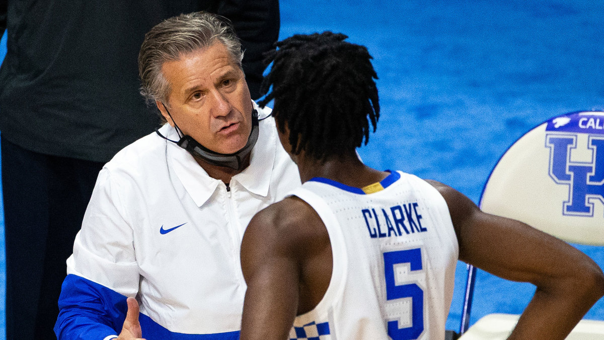 Kentucky coach John Calipari speaks to a player