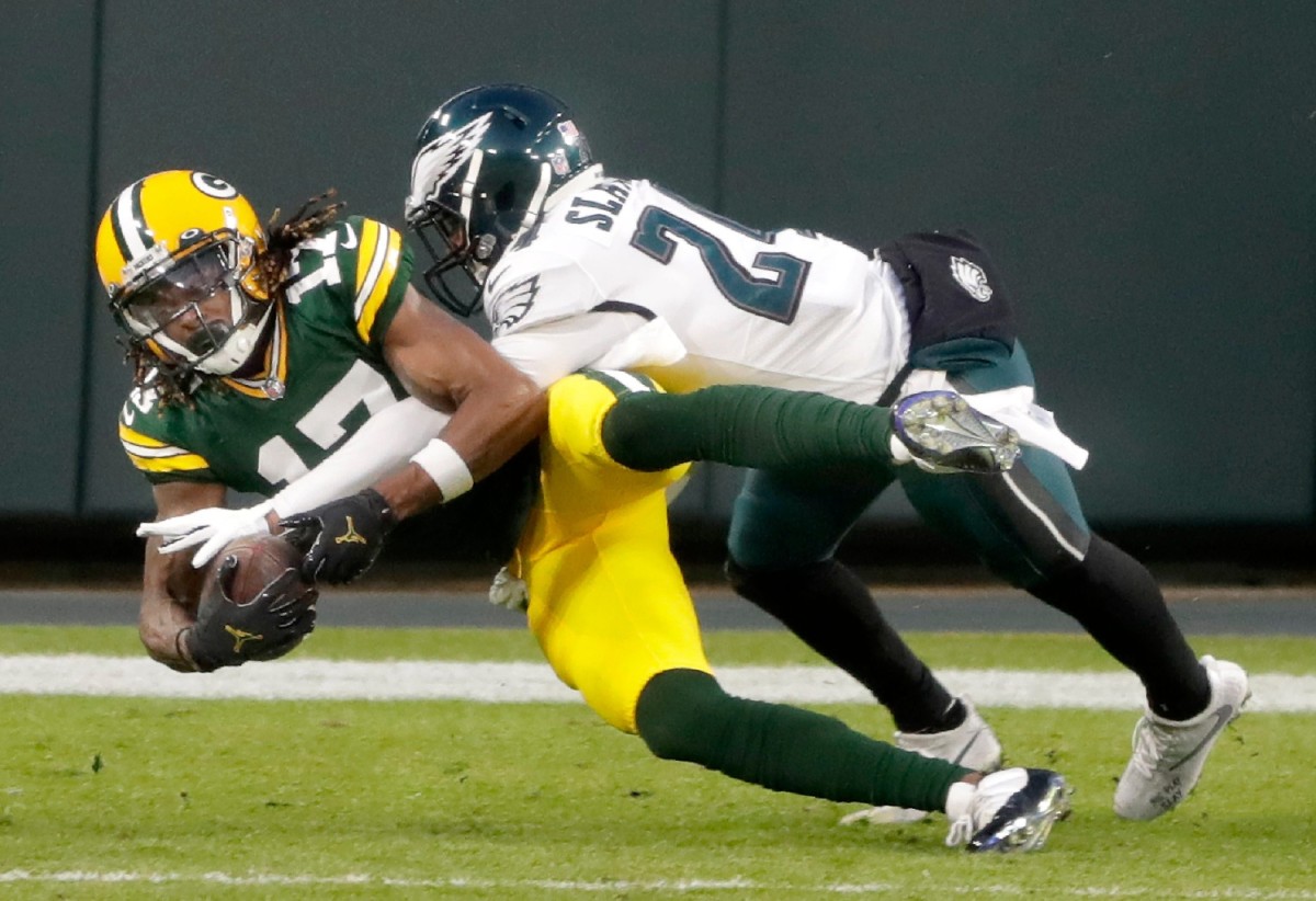 Green Bay Packers wide receiver Davante Adams (17) catches a second-quarter touchdown pass against the defense of Philadelphia Eagles cornerback Darius Slay (24) on Sunday, December 6, 2020, at Lambeau Field in Green Bay,