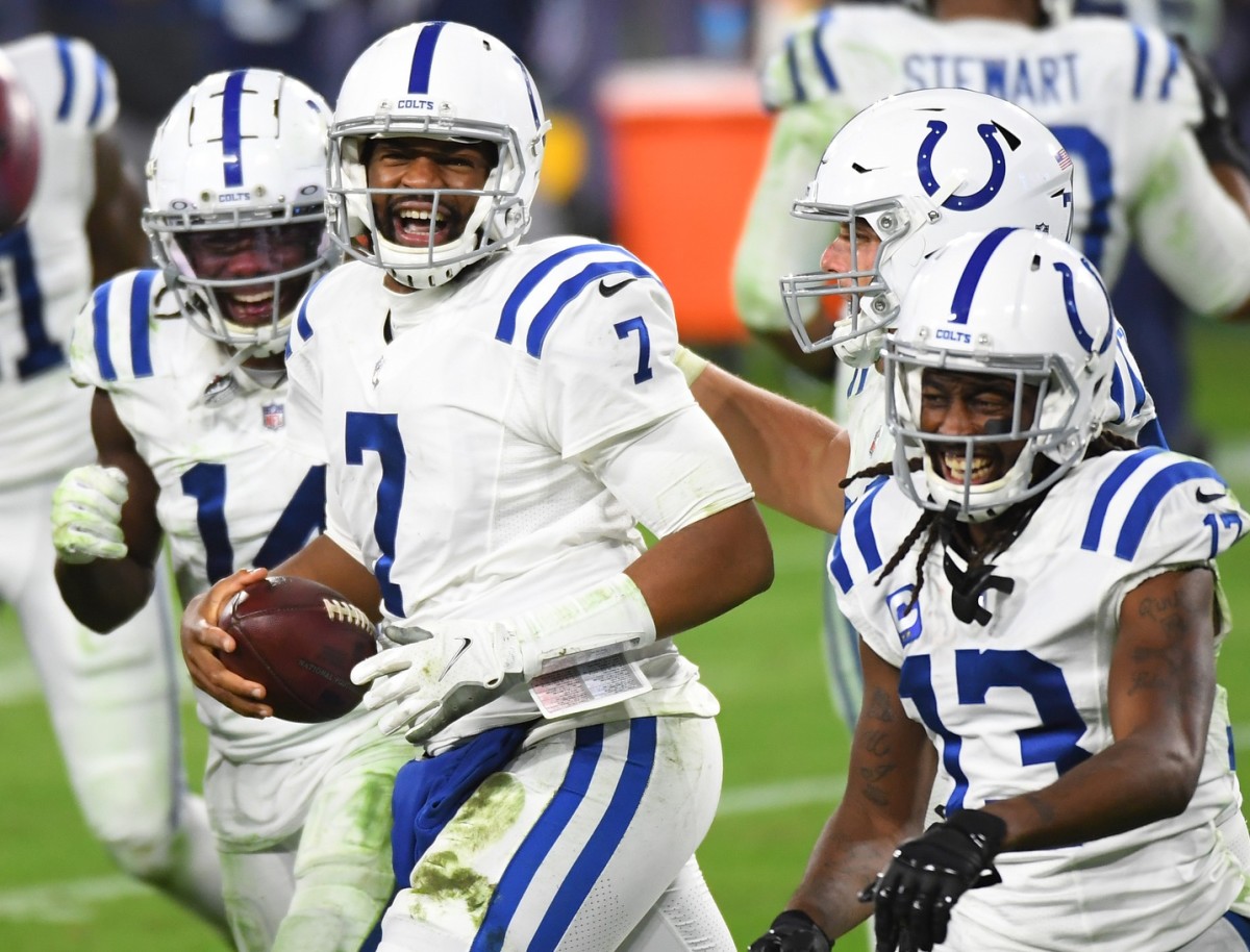 Indianapolis Colts quarterback Jacoby Brissett (7) celebrates a score with teammates in a road game at Nashville, Tenn.