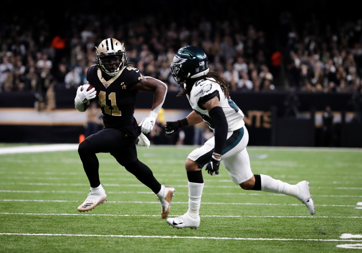 Jan 13, 2019; New Orleans, LA, USA; New Orleans Saints running back Alvin Kamara (41) runs past Philadelphia Eagles free safety Avonte Maddox (29) during the third quarter of a NFC Divisional playoff football game at Mercedes-Benz Superdome. Mandatory Credit: Derick E. Hingle-USA TODAY 