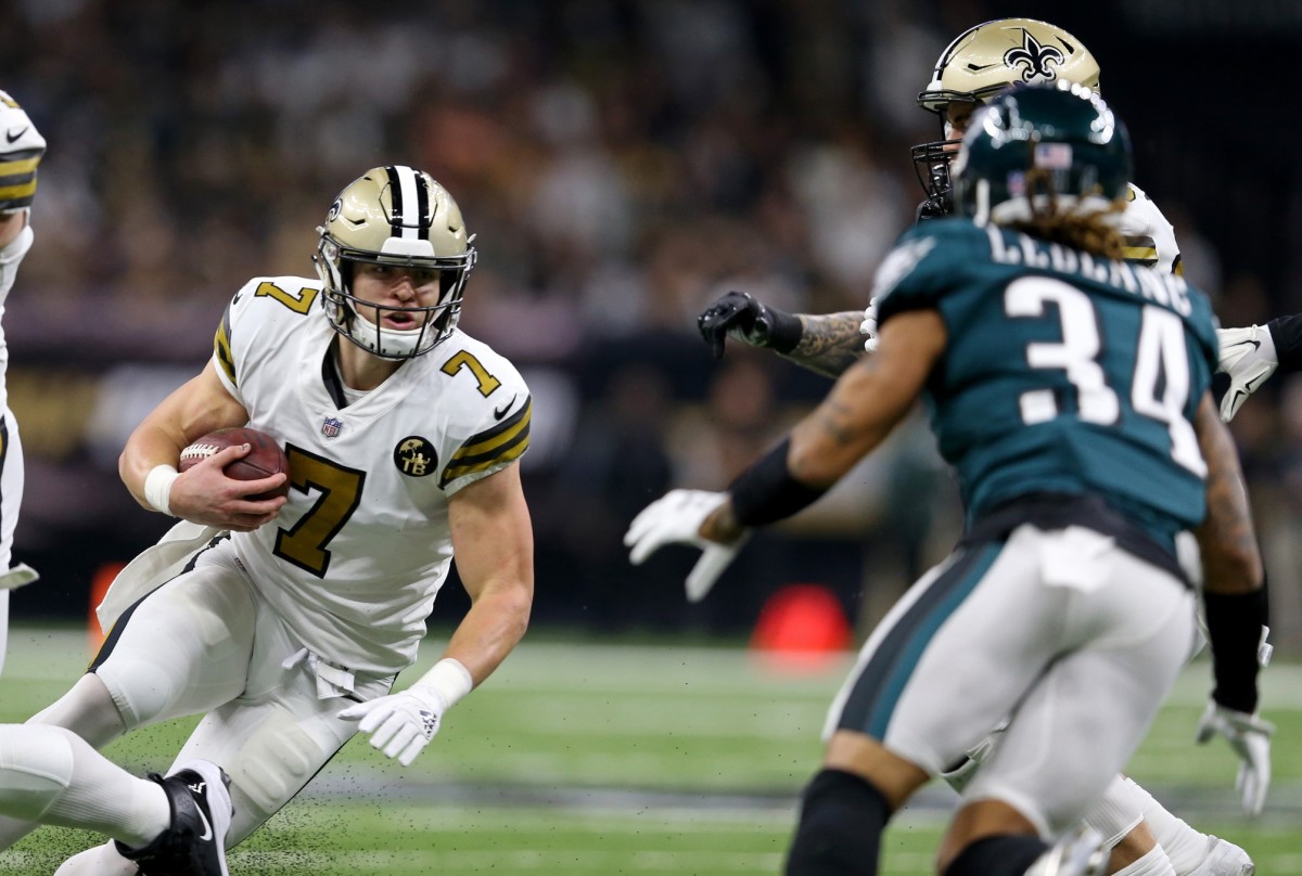 Nov 18, 2018; New Orleans, LA, USA; New Orleans Saints quarterback Taysom Hill (7) runs while defended by Philadelphia Eagles cornerback Cre'von LeBlanc (34) in the first quarter at the Mercedes-Benz Superdome. Mandatory Credit: Chuck Cook-USA TODAY 