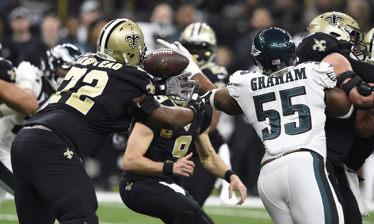 Jan 13, 2019; New Orleans, LA, USA; New Orleans Saints offensive tackle Terron Armstead (72) and Philadelphia Eagles defensive end Brandon Graham (55) try to recover a loose ball during the first quarter of a NFC Divisional playoff football game at Mercedes-Benz Superdome. Mandatory Credit: John David Mercer-USA TODAY 