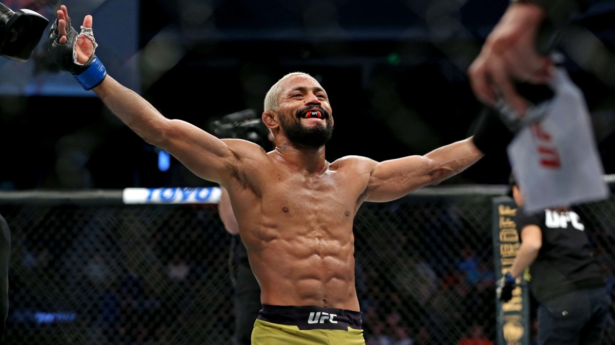 Deiveson Figueiredo (blue gloves) celebrates beating Joseph Benavidez (red gloves) during UFC Fight Night at Chartway Arena.