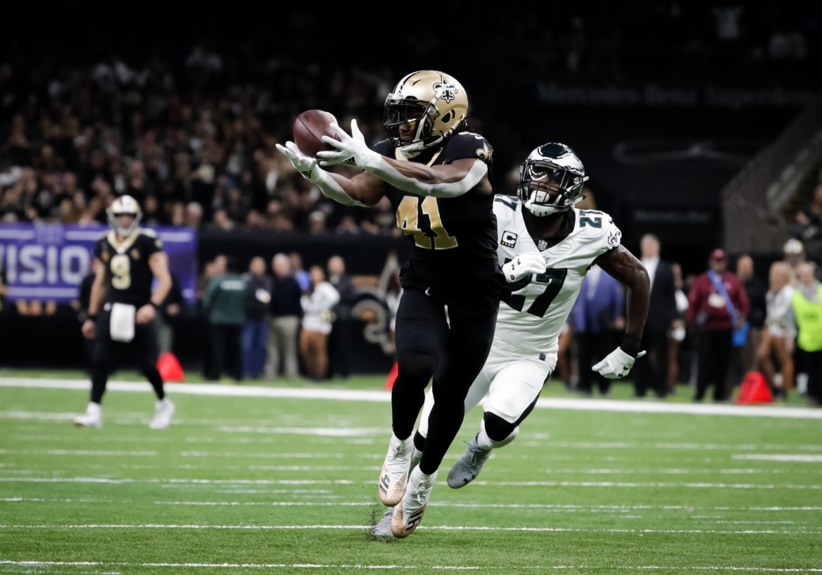 Jan 13, 2019; New Orleans, LA, USA; New Orleans Saints running back Alvin Kamara (41) catches a touchdown pass over Philadelphia Eagles strong safety Malcolm Jenkins (27) during the third quarter of a NFC Divisional playoff football game at Mercedes-Benz Superdome. Mandatory Credit: Derick E. Hingle-USA TODAY 