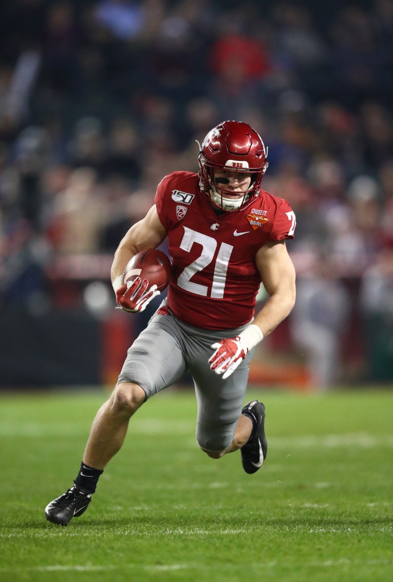 Dec 27, 2019; Phoenix, Arizona, USA; Washington State Cougars running back Max Borghi (21) against the Air Force Falcons during the first half of the Cheez-It Bowl at Chase Field.