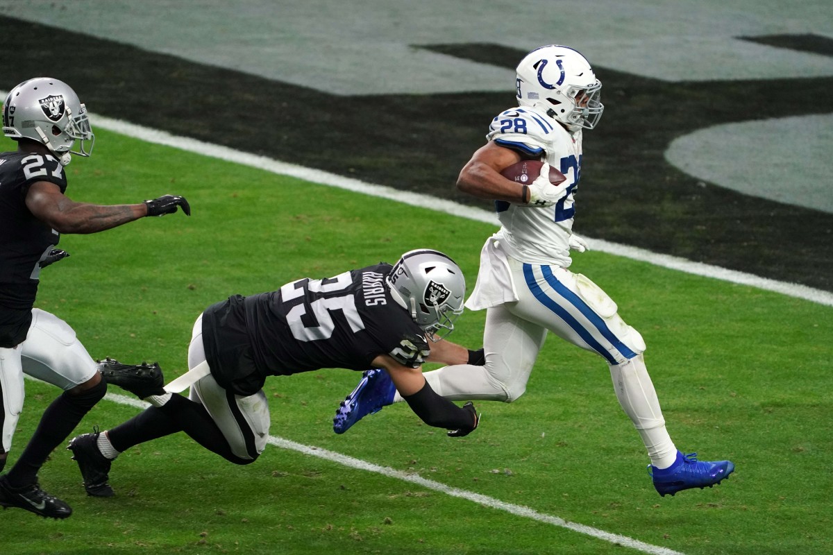 Indianapolis Colts rookie running back Jonathan Taylor finishes a 62-yard touchdown run in Sunday's win at Las Vegas.