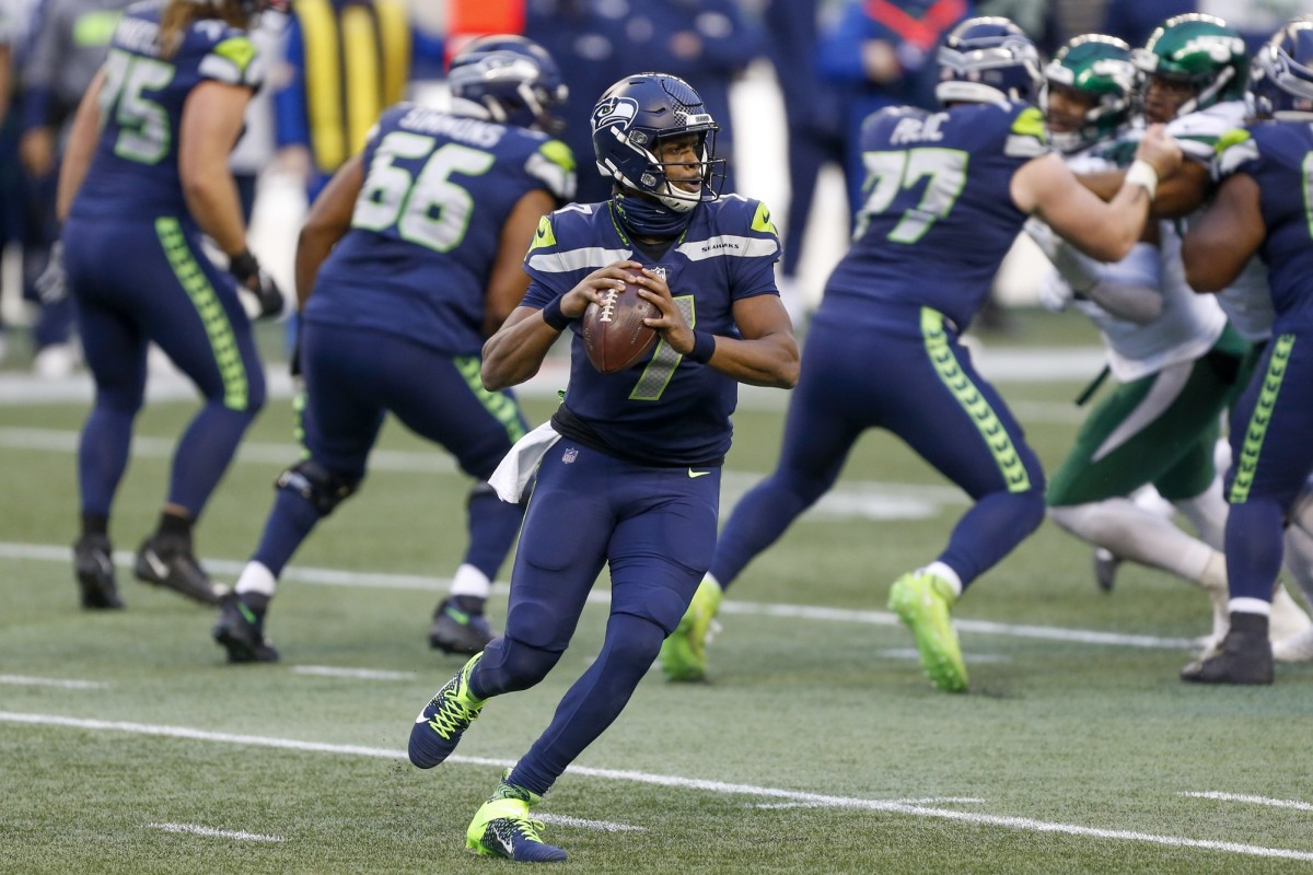 Seattle Seahawks quarterback Geno Smith (7) passes against the New York Jets during the fourth quarter at Lumen Field.