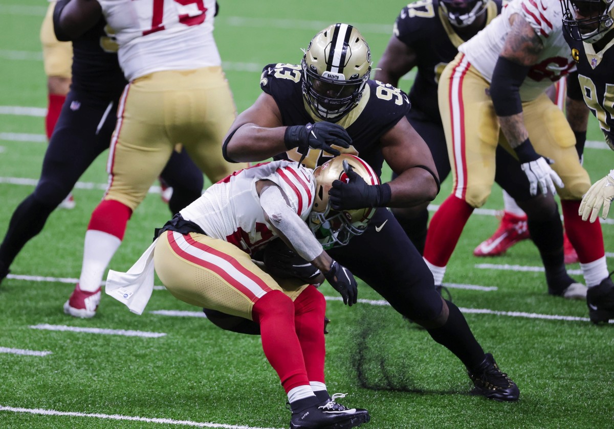 Nov 15, 2020; New Orleans, Louisiana, USA; New Orleans Saints defensive tackle David Onyemata (93) stops San Francisco 49ers running back Jerick McKinnon (28) during the first quarter at the Mercedes-Benz Superdome. Mandatory Credit: Derick E. Hingle-USA TODAY Sports