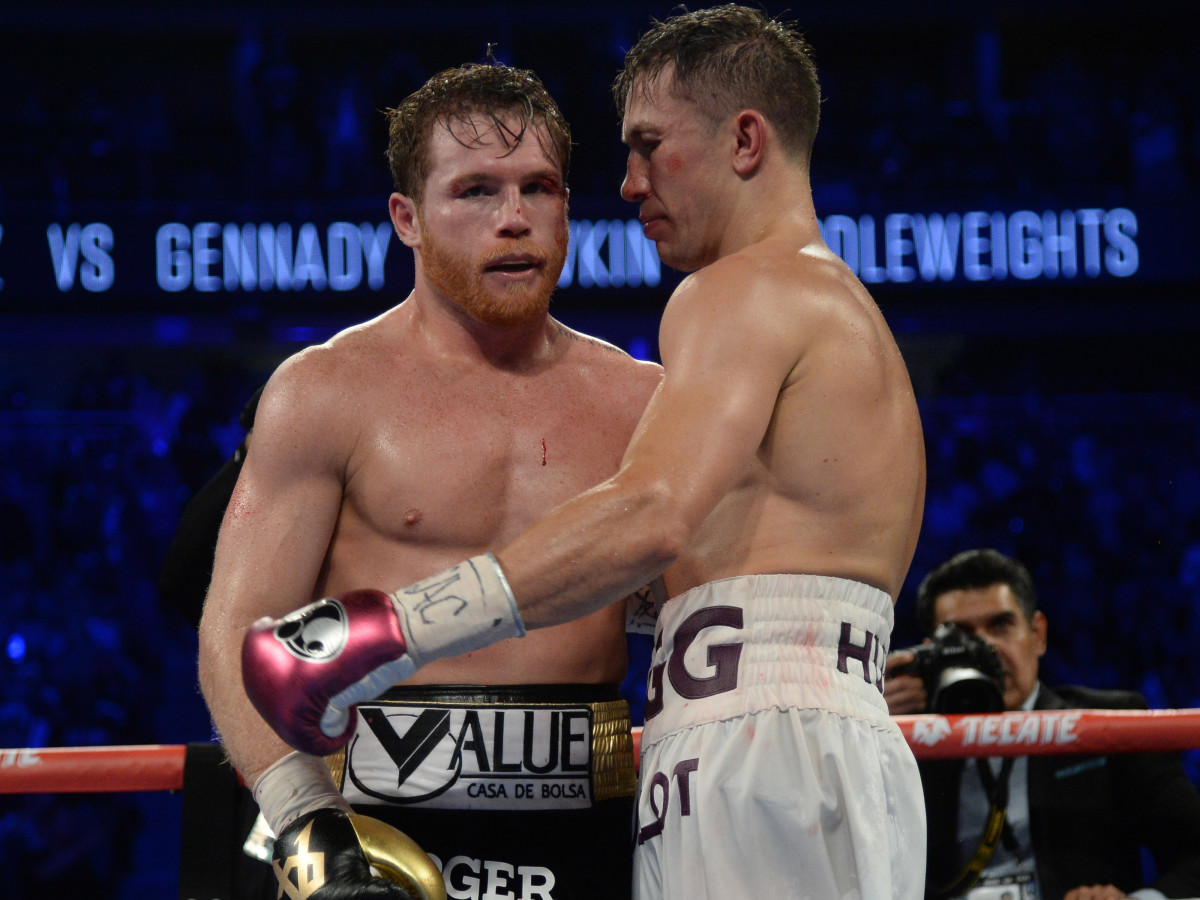 Canelo Alvarez (black trunks) and Gennady Golovkin (white trunks) hug after their middleweight world championship boxing match at T-Mobile Arena.