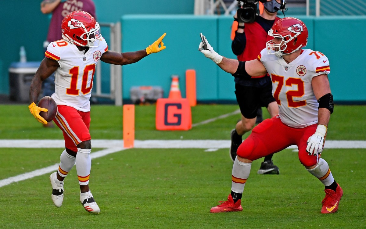 Dec 13, 2020; Miami Gardens, Florida, USA; Kansas City Chiefs wide receiver Tyreek Hill (10) celebrates his touchdown against the Miami Dolphins with offensive tackle Eric Fisher (72) during the second half at Hard Rock Stadium. Mandatory Credit: Jasen Vinlove-USA TODAY Sports