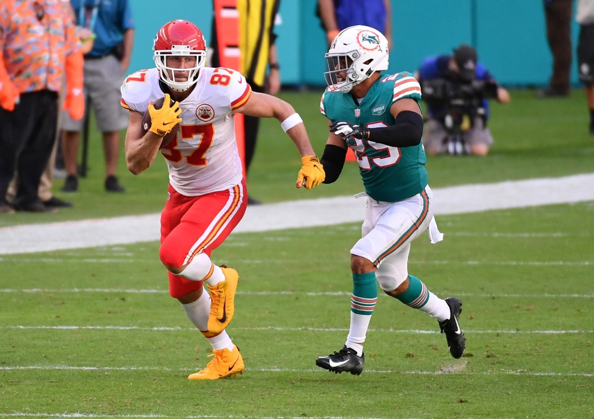Dec 13, 2020; Miami Gardens, Florida, USA; Kansas City Chiefs tight end Travis Kelce (87) runs after the catch against the Miami Dolphins during the second half at Hard Rock Stadium. Mandatory Credit: Jasen Vinlove-USA TODAY Sports