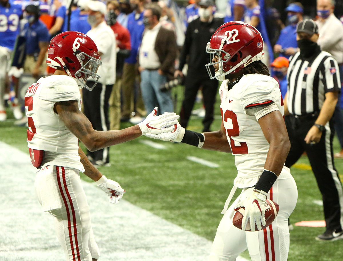 DeVonta Smith and Najee Harris celebrate a touchdown in the 2020 SEC Championship Game