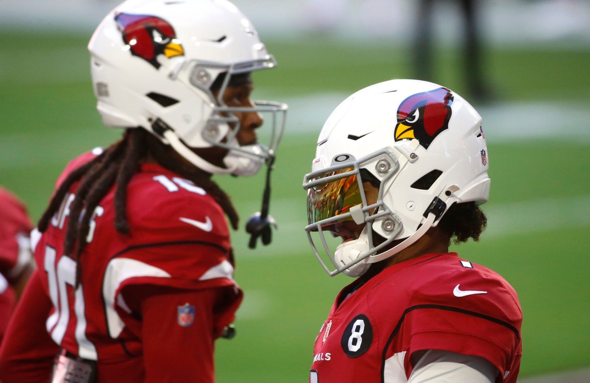 Cardinals' Kyler Murray (1) warms up with Deandre Hopkins (10) before a game against the Eagles at State Farm Stadium in Glendale, Ariz. on Dec. 20, 2020.