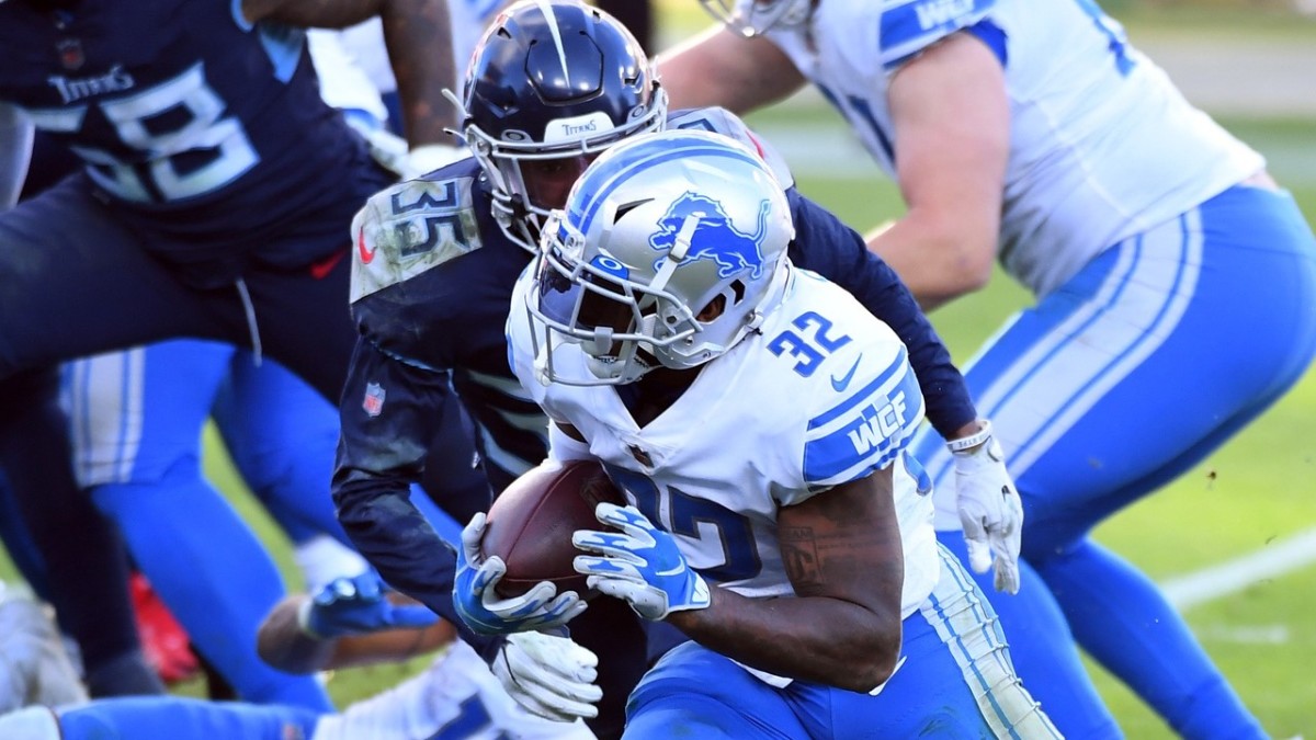 Swift runs for a touchdown against the Tennessee Titans. 
