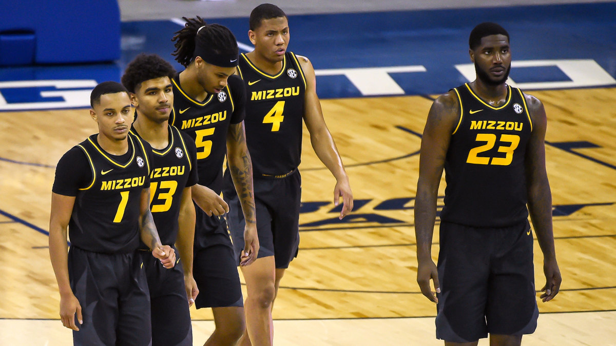 Missouri basketball players look on during a game