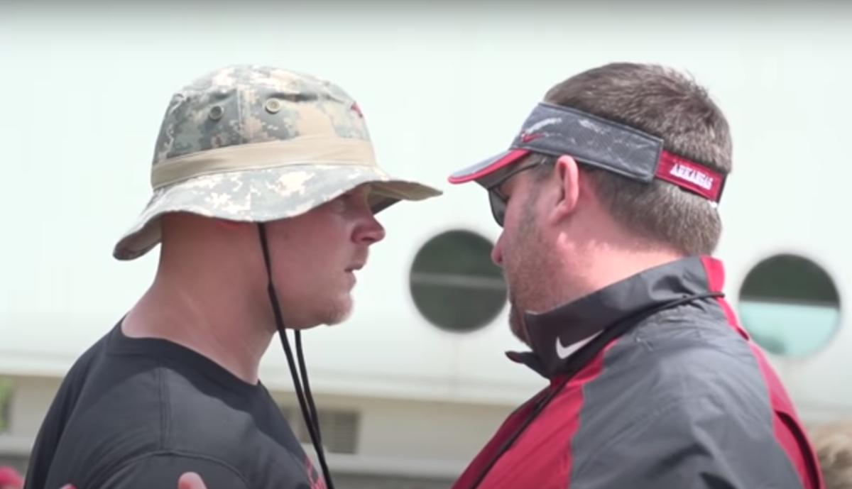 Ben Herbert (left) speaking before a 2017 practice with then-Arkansas head coach Bret Bielema. Before following Bielema to Arkansas, Herbert was Wisconsin's head strength and conditioning coach the final four seasons (2009-12) of Bielema’s tenure with the Badgers.